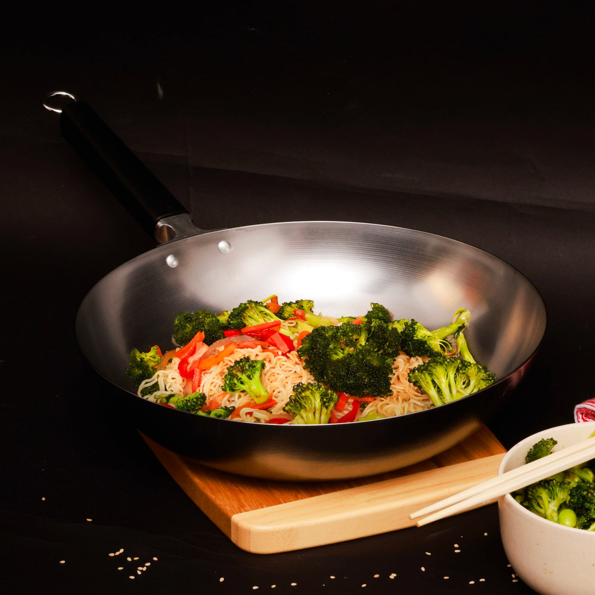 J22-0050 - Joyce Chen Uncoated Carbon Steel Stir Fry Pan with Phenolic Handle, 12"